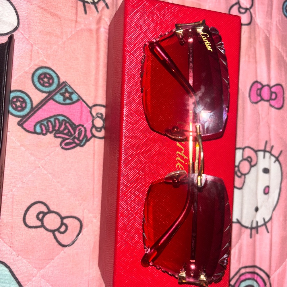Cartier glasses sunglasses with a red color
